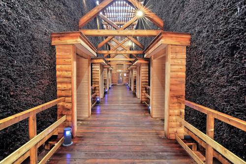 a wooden walkway in a wine cellar with a ceiling at Kurvilla Fürstin Pauline in Bad Salzuflen