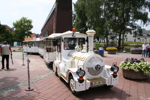 a small train engine is parked in a park at Kurvilla Fürstin Pauline in Bad Salzuflen