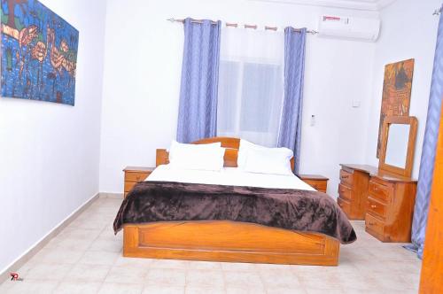 Postel nebo postele na pokoji v ubytování Kums Apartment
