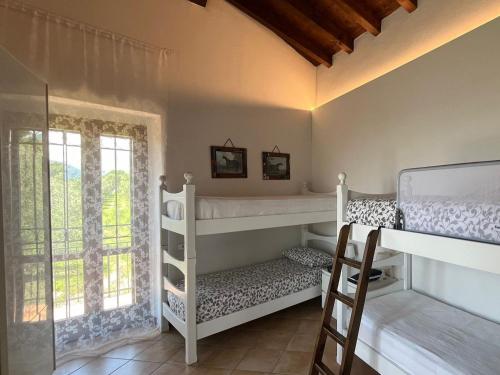 A bed or beds in a room at Agriturismo valsiniga