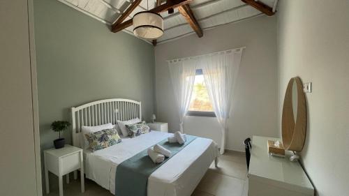 A bed or beds in a room at VILLA ANTHIMOS