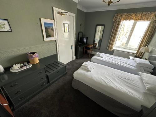 Ένα ή περισσότερα κρεβάτια σε δωμάτιο στο Clarkes Hotel Barrow in Furness