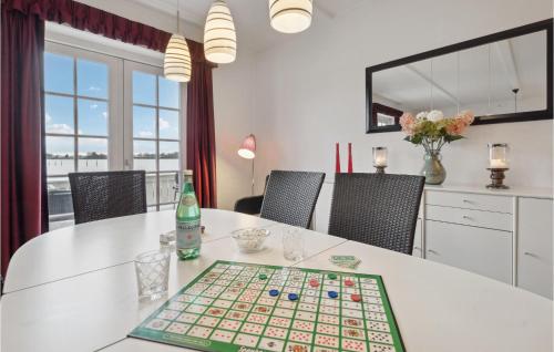 a table with a chess board on top of it at Two-Bedroom Apartment In Grasten in Gråsten
