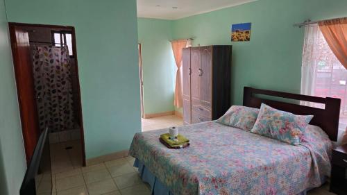 a bedroom with a bed with a candle on it at Hostal Mirador in San Pedro de Atacama