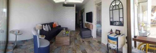 a living room with a couch and a tv at 2 Bedroom Chalet in Kaslik Generator is including in Jounieh