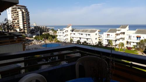 a balcony with a view of the ocean and buildings at 2 Bedroom Chalet in Kaslik Generator is including in Jounieh