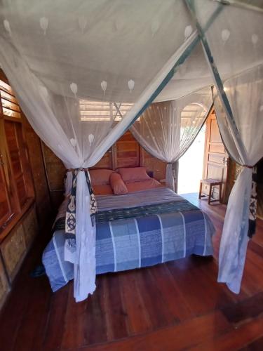 Postel nebo postele na pokoji v ubytování Praikamarru Home Stay