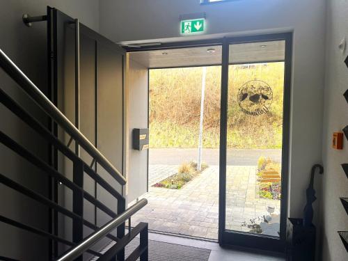 a door to a entrance with a skull on the wall at Weingut & Straußwirtschaft Vogel in Vogtsburg