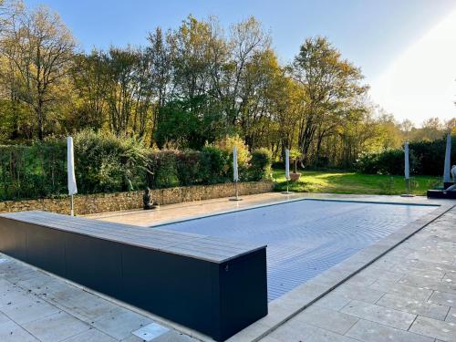 a basketball court in a park with a basketball hoop at Gîte - Le Petit Noyer in Le Bugue