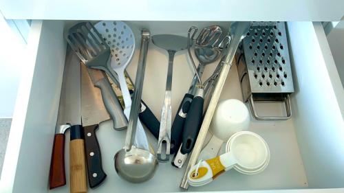 a drawer filled with lots of utensils at VIP 375 large studio, ocean view in Rayong