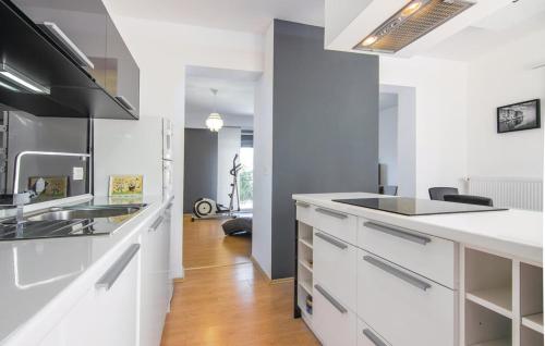 a kitchen with white cabinets and a counter top at Casa Fiori in Fiorini