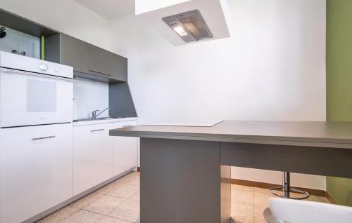 a kitchen with a table and a counter top at Casa Fiori in Fiorini