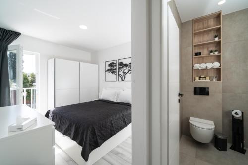 En eller flere senge i et værelse på Luxury Villa Entrata