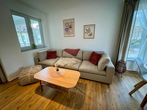 a living room with a couch and a table at S4 FeWo in Bad Saarow, Seestr 4a in Bad Saarow