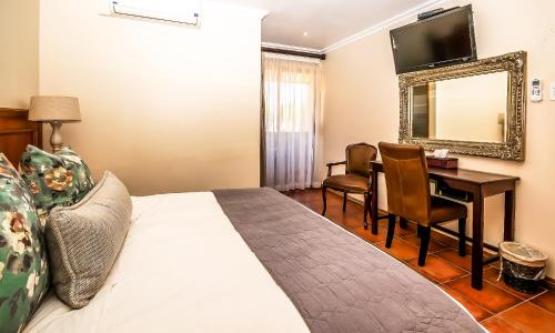 Ένα ή περισσότερα κρεβάτια σε δωμάτιο στο Sunward Park Guest House & Conference Center