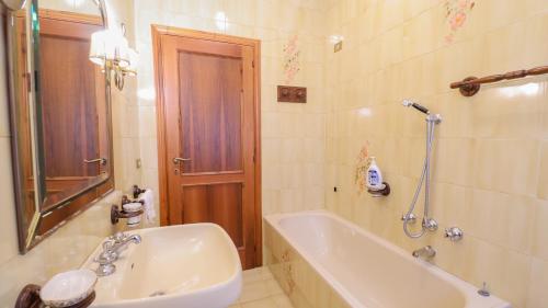 a bathroom with a tub and a toilet and a sink at VILLA PRESTIGE - with Balconies in Monsummano