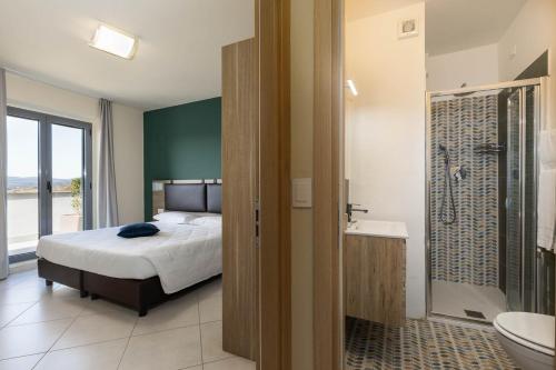 Koupelna v ubytování Tuscasì Aparthotel