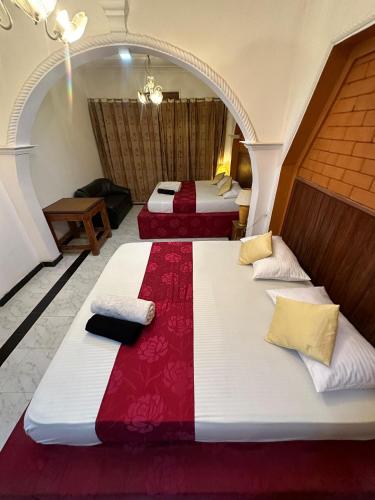 Maha Gedara Grand Hotelにあるベッド