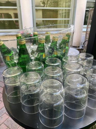 a bunch of empty glasses and bottles on a table at ProfilHotels Central in Stockholm