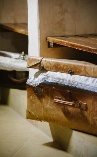 two old suitcases stacked on top of each other at Borgoterra in Martano
