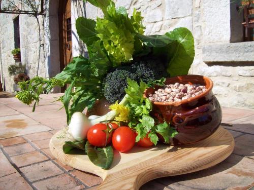 a bunch of vegetables sitting on a cutting board at La Locanda Del Ruspante in Castro dei Volsci
