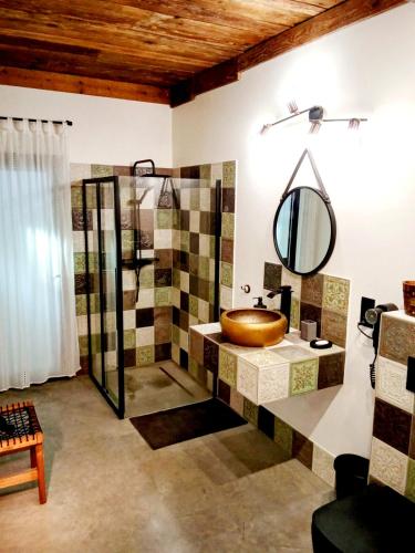 a bathroom with a sink and a mirror at Szumidomki strefa z jacuzzi sauna widok na potok las in Zawoja
