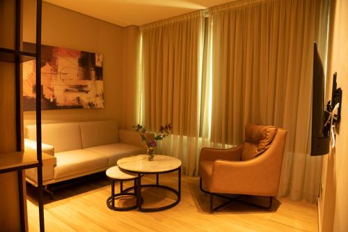 a living room with a couch and a table at The Blowfish Hotel in Lagos