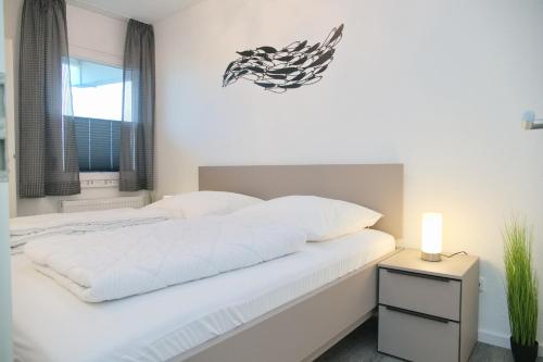 Ένα ή περισσότερα κρεβάτια σε δωμάτιο στο Grömitz- Center II App 06 inkl WLAN