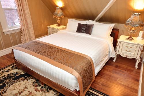 Postel nebo postele na pokoji v ubytování Prince inn