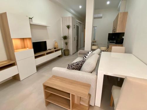 TV o dispositivi per l'intrattenimento presso Palangreros Beach Apartment