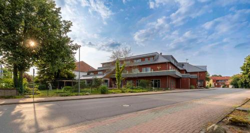 a house on the side of a street at Best Western Hotel Heidehof in Hermannsburg