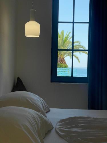 Un ou plusieurs lits dans un hébergement de l'établissement Cava Boutique Hotel