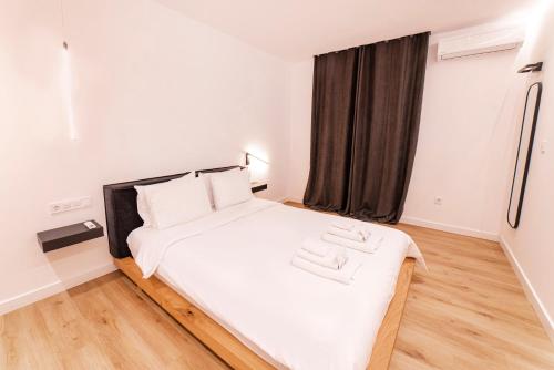Ένα ή περισσότερα κρεβάτια σε δωμάτιο στο White harmony, 2 bedroom apartment