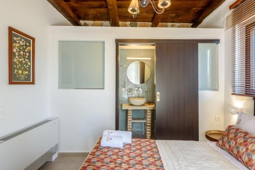 Postel nebo postele na pokoji v ubytování Minos Country Living Apartments