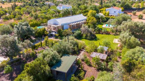 an aerial view of a house with a garden at Laranjal Farm House in Moncarapacho