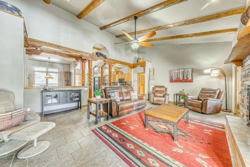 a living room with leather furniture and a fireplace at Near Hiking Trails Spacious Cloudcroft Retreat! in Cloudcroft