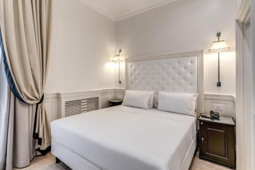 Ein Bett oder Betten in einem Zimmer der Unterkunft ACA Hotel Viminale