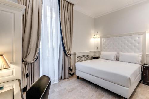 Ein Bett oder Betten in einem Zimmer der Unterkunft ACA Hotel Viminale