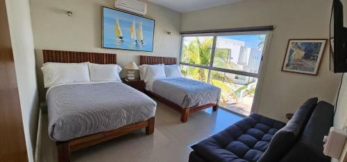 Giường trong phòng chung tại Marina Vallarta Golf and Pool
