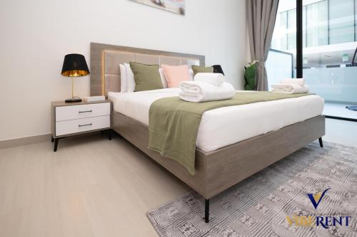 Modern & Spacious 1BR in JVC, Rooftop Pool & Parking