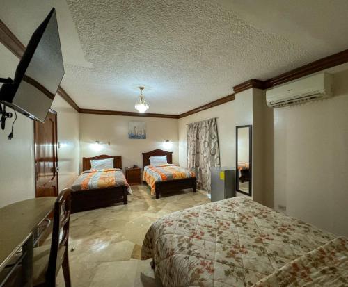 Postel nebo postele na pokoji v ubytování Hotel Bucaneiro