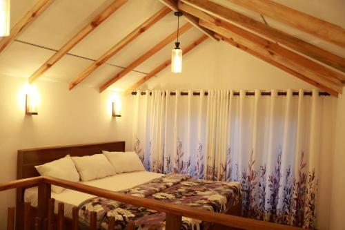 Postel nebo postele na pokoji v ubytování Fertile land resort adam's peak