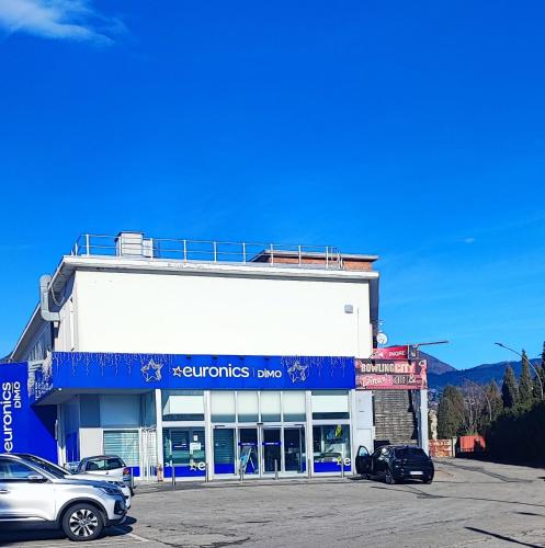 a building with cars parked in a parking lot at Tominettihome in Verbania
