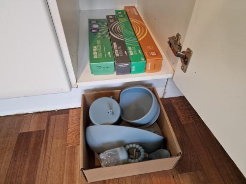 a box in the floor with two books on it at Hornscroft Park - Contemporary luxury and style in Hull