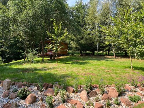a garden with rocks in the middle of a yard at Tiny Resort Chotěvice 1 in Chotěvice