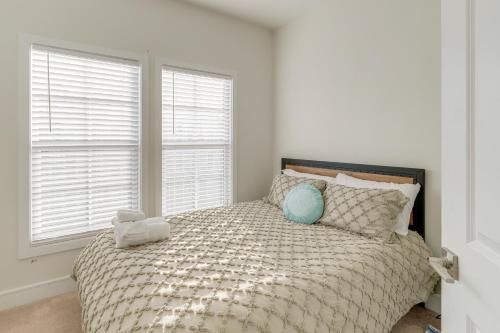 a bedroom with a bed with a teddy bear on it at Balcony and Pool Access Modern Gainesville Home in Gainesville