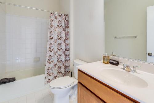 a bathroom with a sink and a toilet and a tub at Balcony and Pool Access Modern Gainesville Home in Gainesville