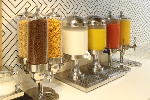 a row of different types of food and drinks at Holiday Inn Express Torreon by IHG in Torreón