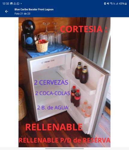 an open refrigerator with drinks in the door at Blue Caribe Bacalar Front Lagoon in Bacalar