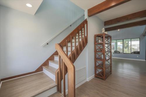 a staircase in a home with wooden floors and a stair case at Sunshine Lagoon in Sanibel